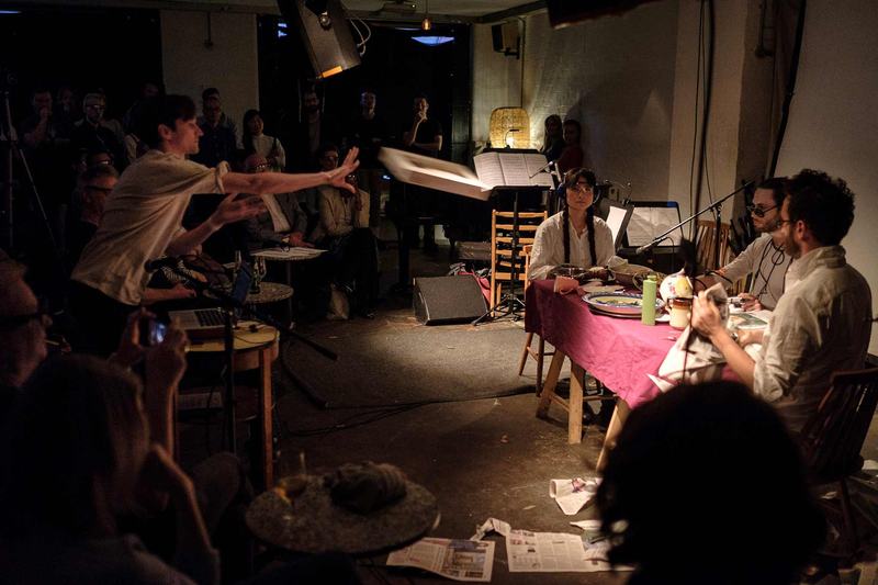 Performers at Cafe OTO, including Neil Luck throwing a pizza box